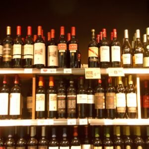 a shelf filled with lots of bottles of wine