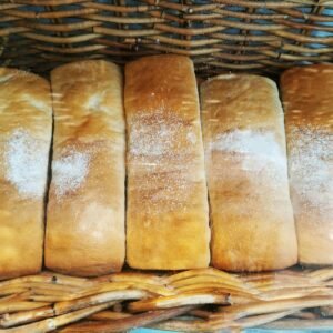 a basket filled with loaves of bread