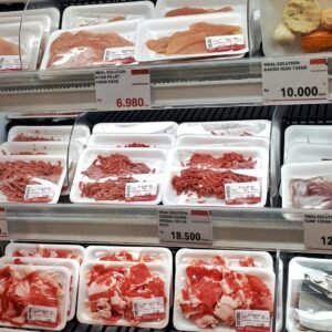 A display case filled with lots of different types of meat
